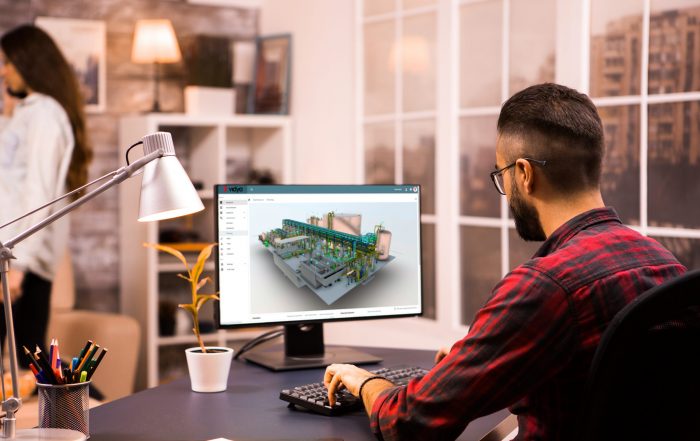 Back view of male engineer drawing a mechanical prototype