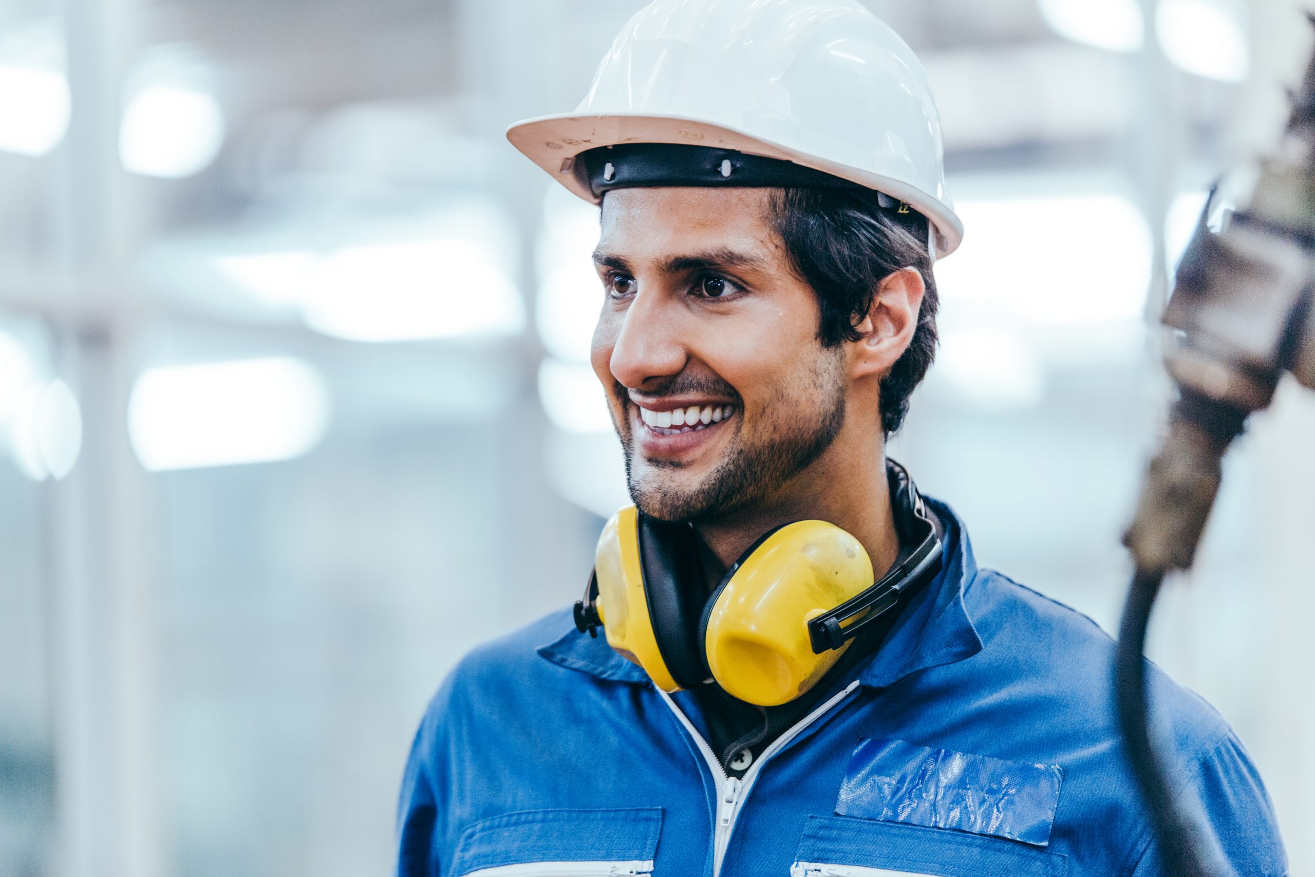 Portrait of smiling male factory worker at construction industry