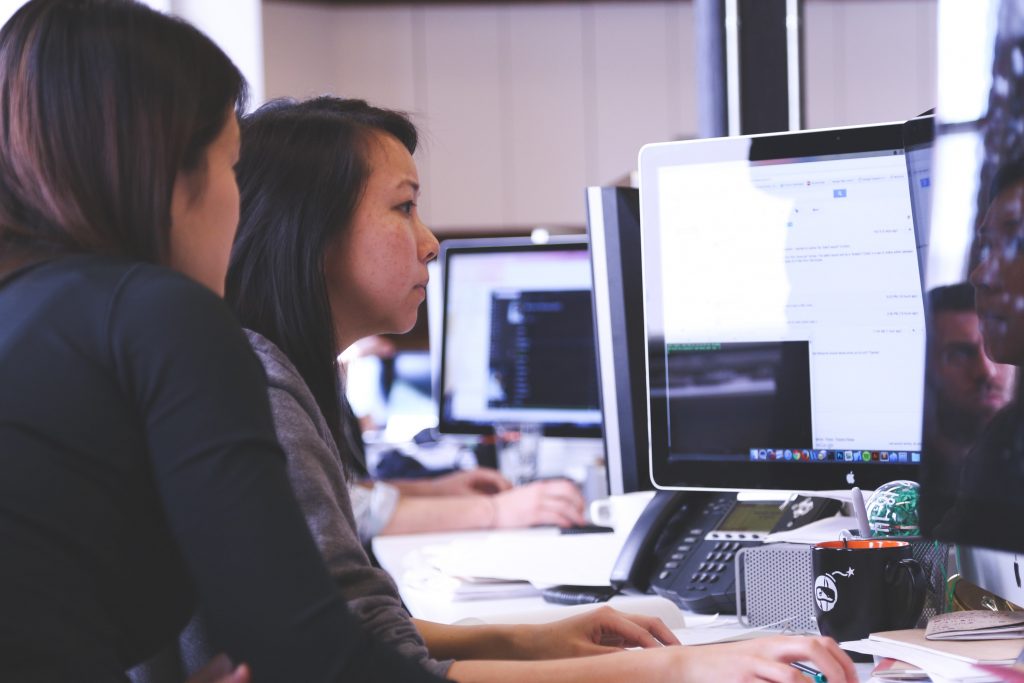 woman on desktop analyzing digital transformation information