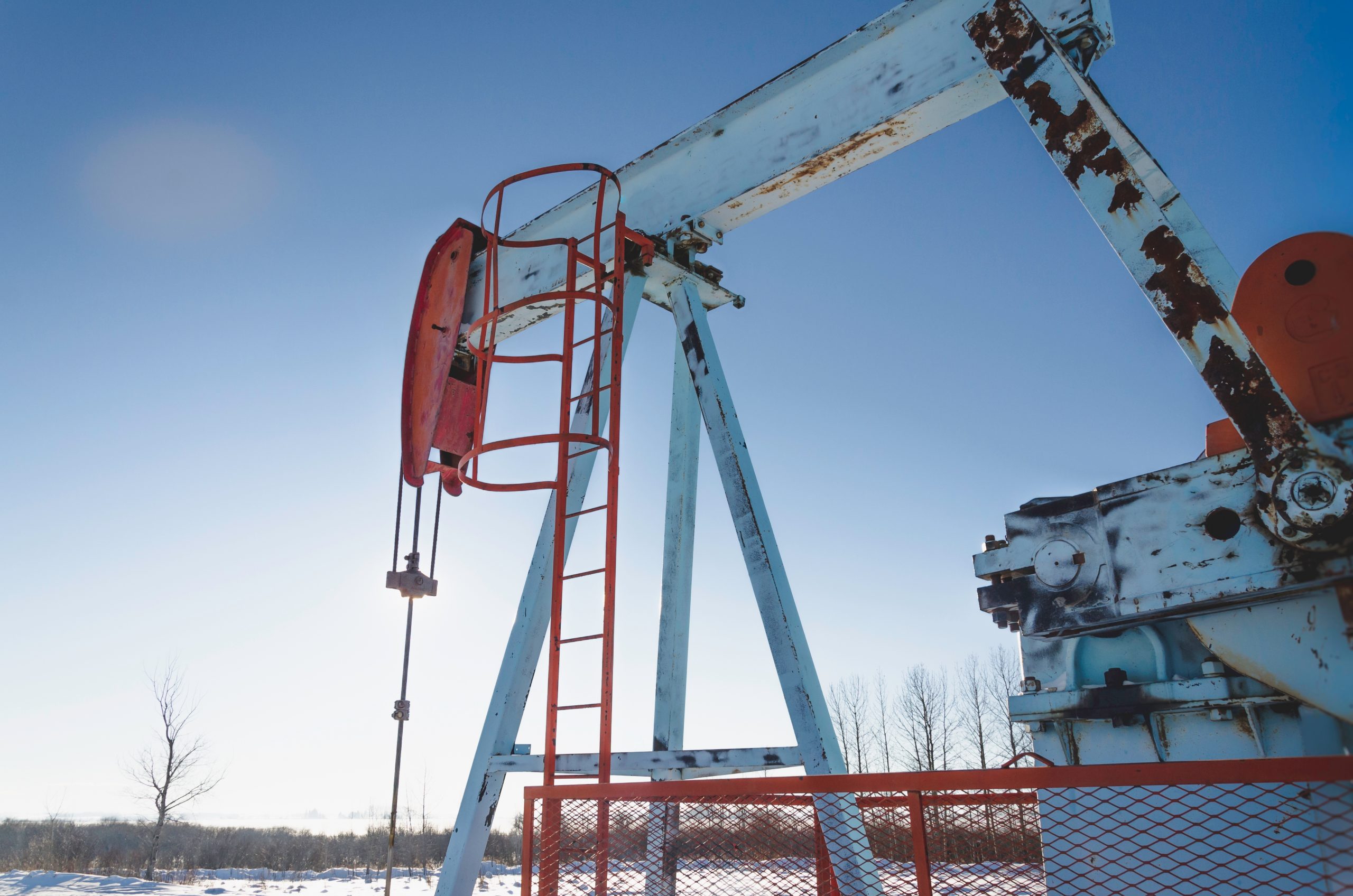 blue-and-red-oil-well-machinery-in-rural-alberta-c-2021-08-31-22-42-18-utc