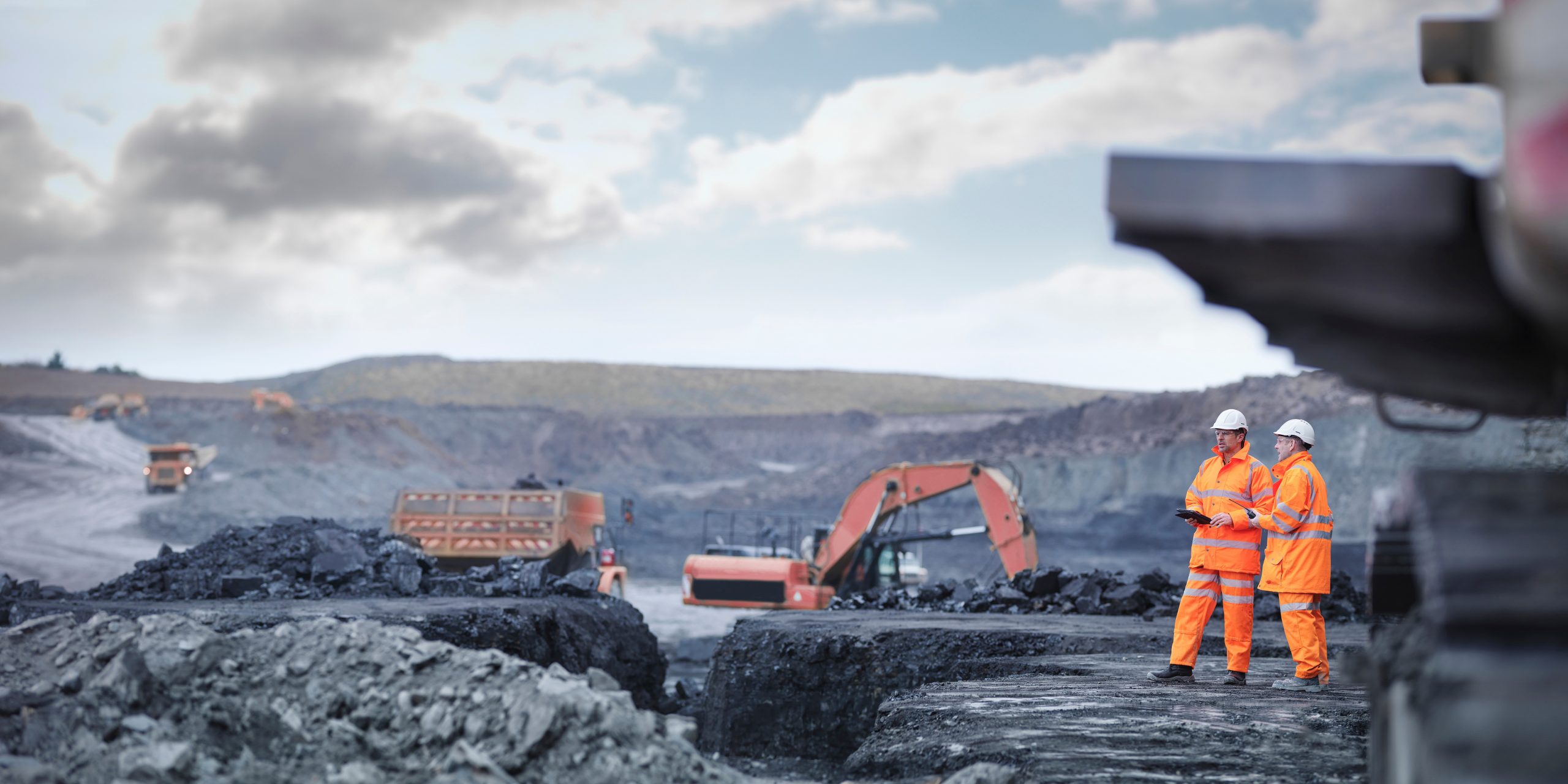 Miners in discussion in surface coal mine