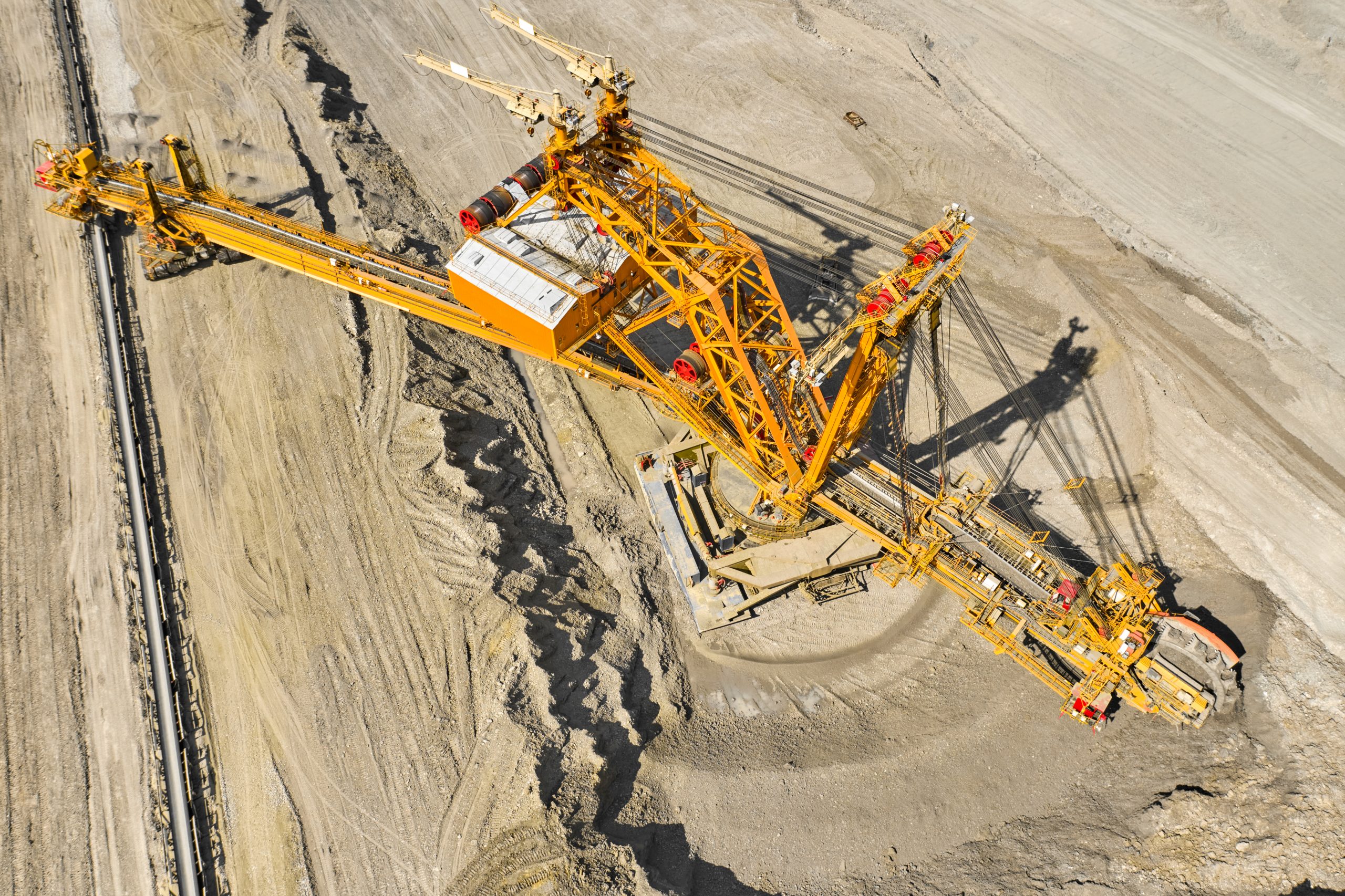 Top view of a bucket wheel excavator mining coal in an open pit mine.