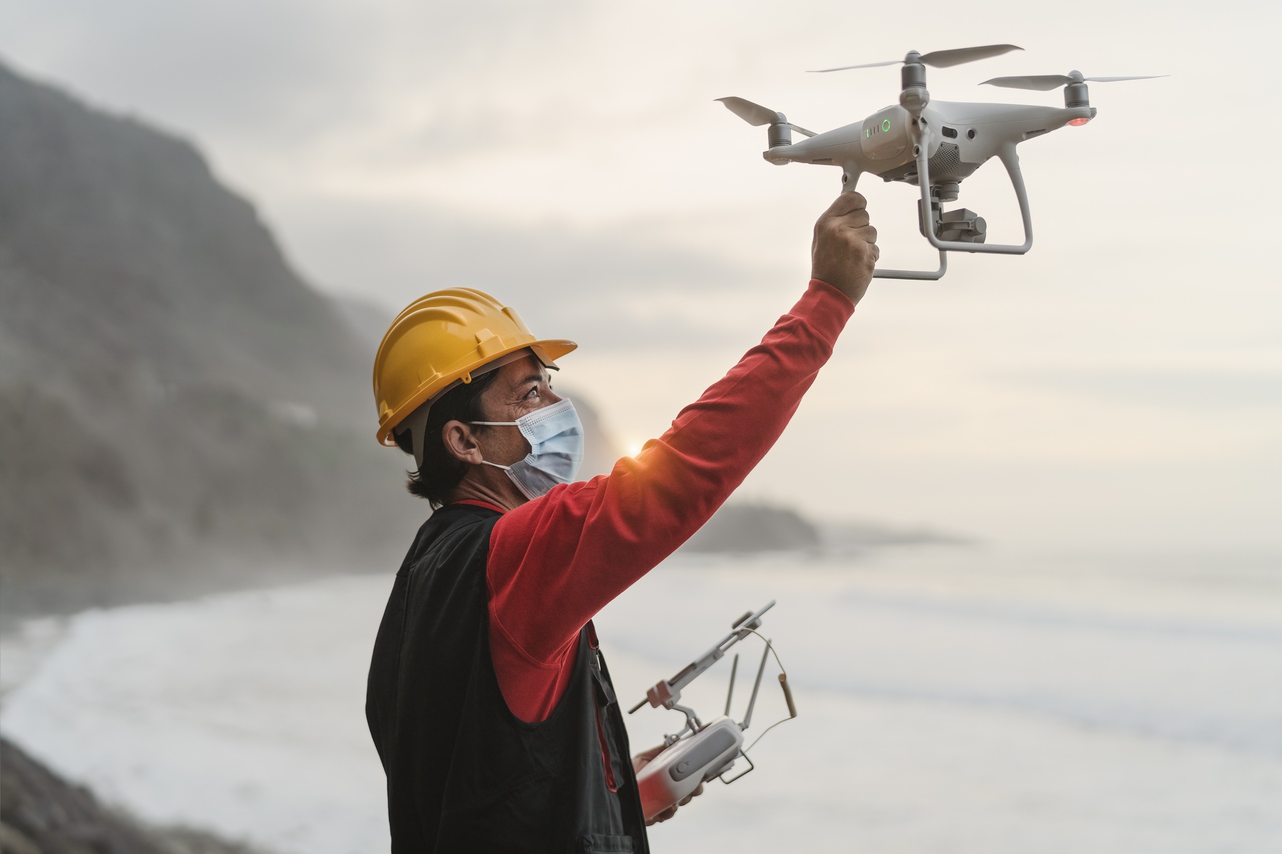 male-engineer-doing-inspection-using-drone