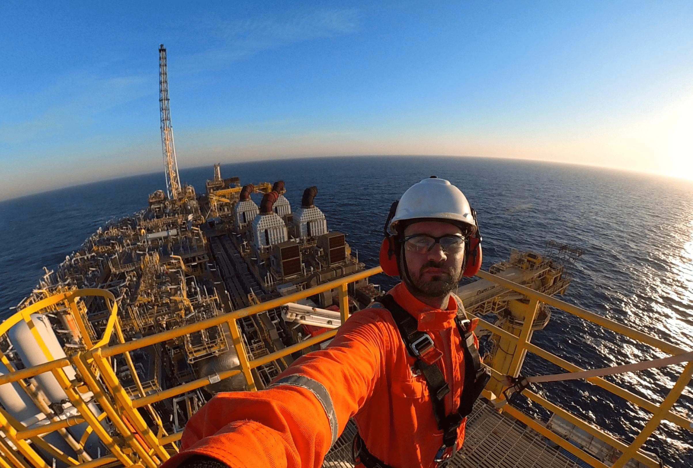 Industrial inspector at the top of FPSO taking a selfie