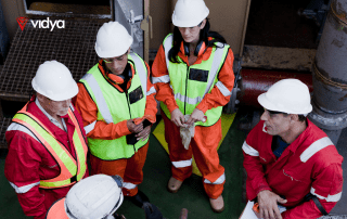 Cover imagem with a group of offshore workers on board, fully equipped with safety gear, preparing for operational activities.