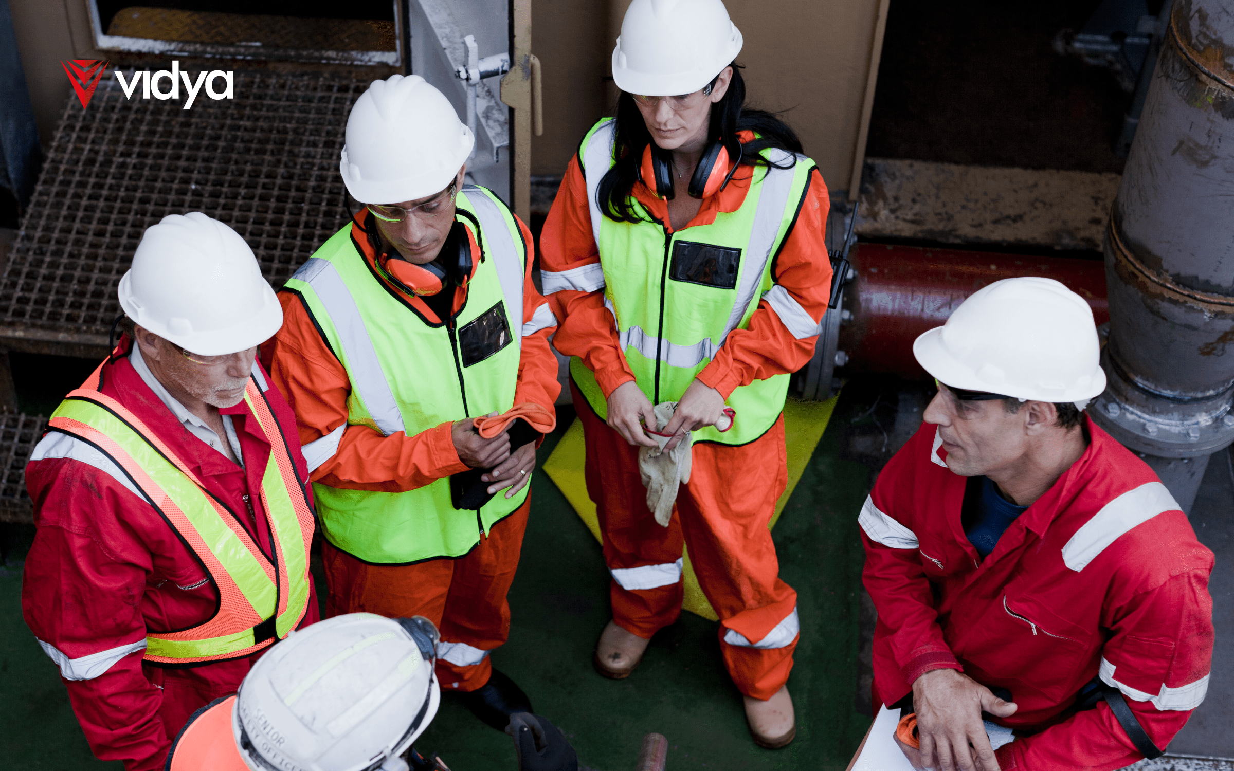 Cover imagem with a group of offshore workers on board, fully equipped with safety gear, preparing for operational activities.