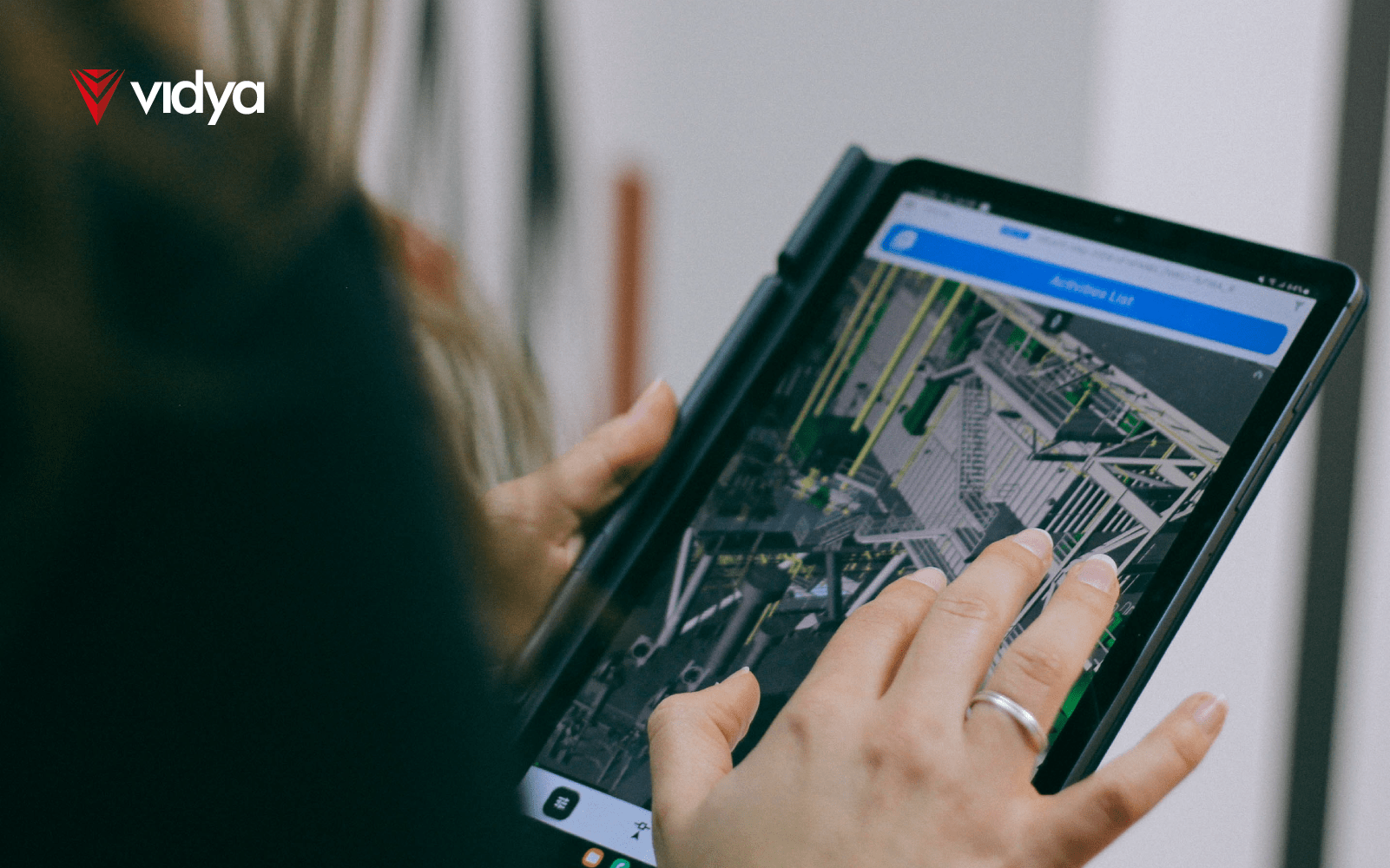 Image of a woman using Vidya System Platforms [VSP] on a tablet.