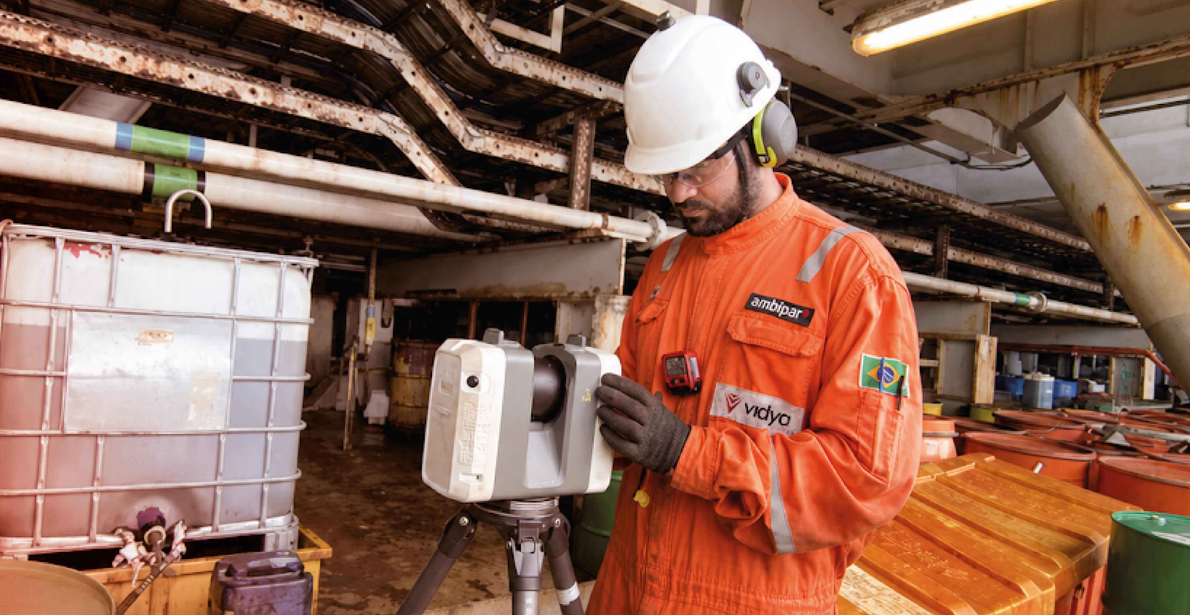 Laser scanning Vidya employee on the field scanning an industrial facility