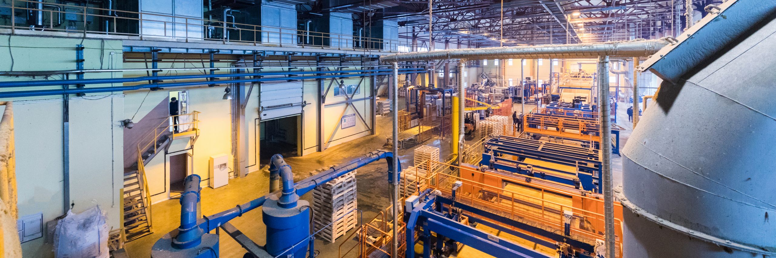 Fiberglass production industry equipment at manufacture background Inside of a plant